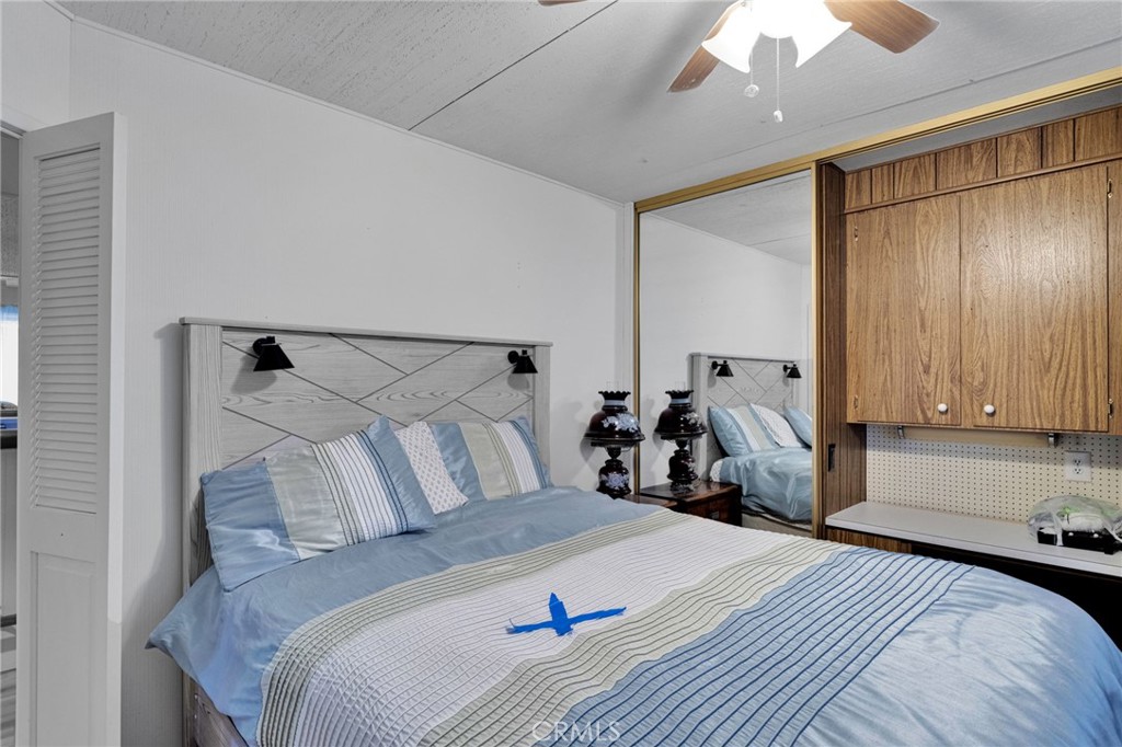 2494 Main Street Barstow, CA 92311 - Photo 20 of 36 a bed room with a bed and a mirror