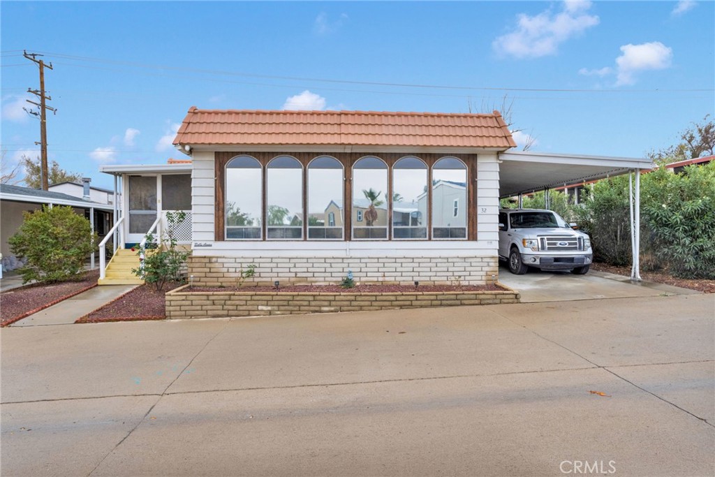 2494 Main Street Barstow, CA 92311 - Photo 2 of 36 a front view of a house with a garden