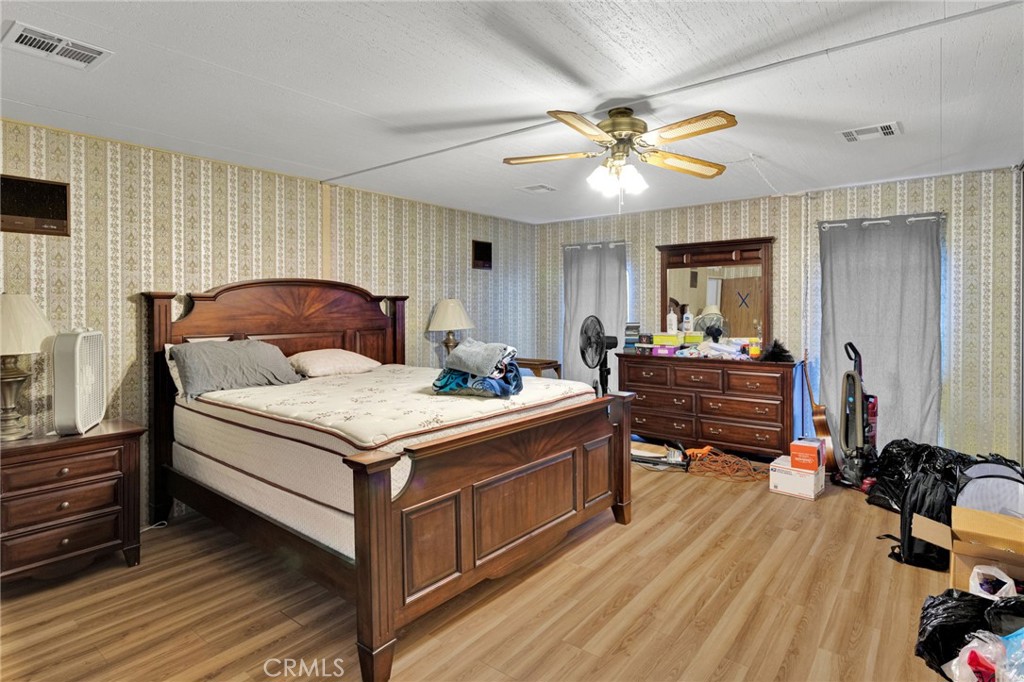 2494 Main Street Barstow, CA 92311 - Photo 23 of 36 a living room with a bed furniture and a large window