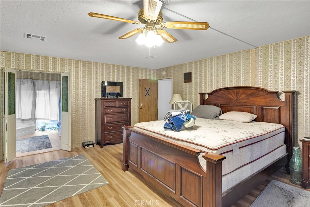 2494 Main Street Barstow, CA 92311 - Photo 24 of 36 a living room with stainless steel appliances kitchen island granite countertop furniture and a flat screen tv