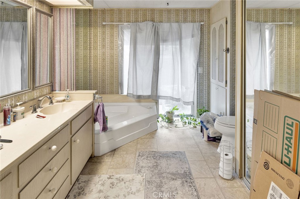 2494 Main Street Barstow, CA 92311 - Photo 25 of 36 a spacious bathroom with a sink double vanity and a bathtub