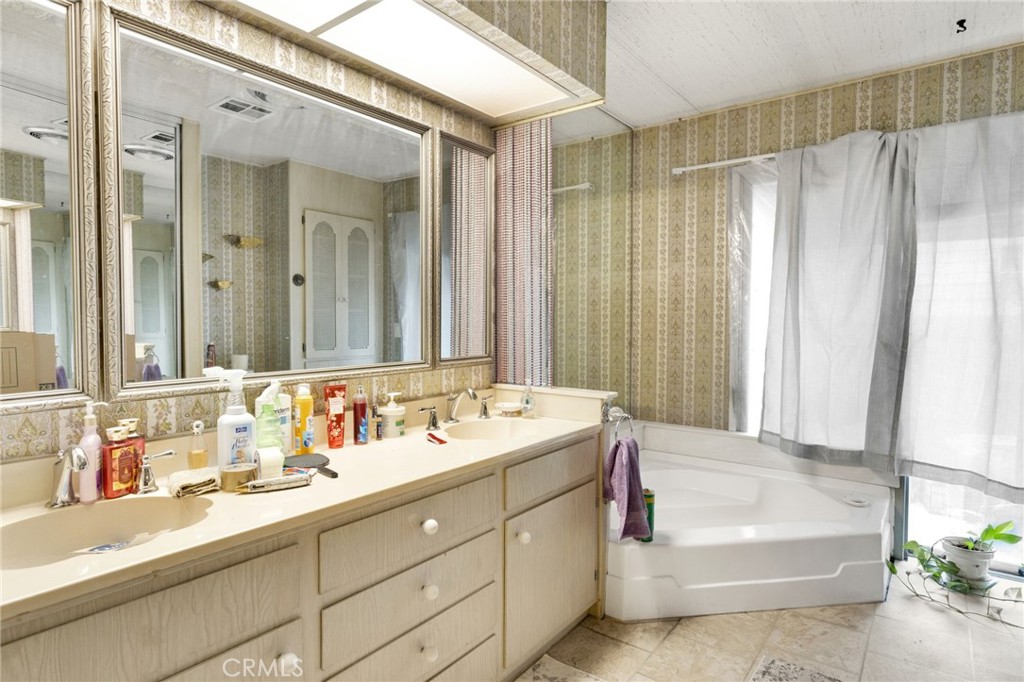 2494 Main Street Barstow, CA 92311 - Photo 26 of 36 a bathroom with a double vanity sink mirror and double