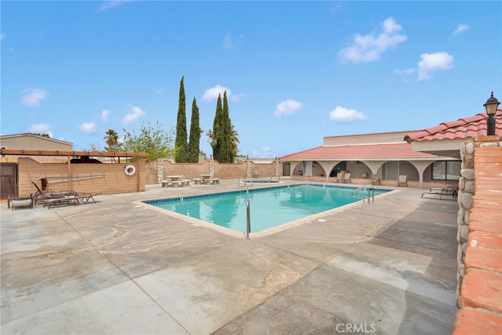 2494 Main Street Barstow, CA 92311 - Photo 34 of 36 a view of a swimming pool with a patio