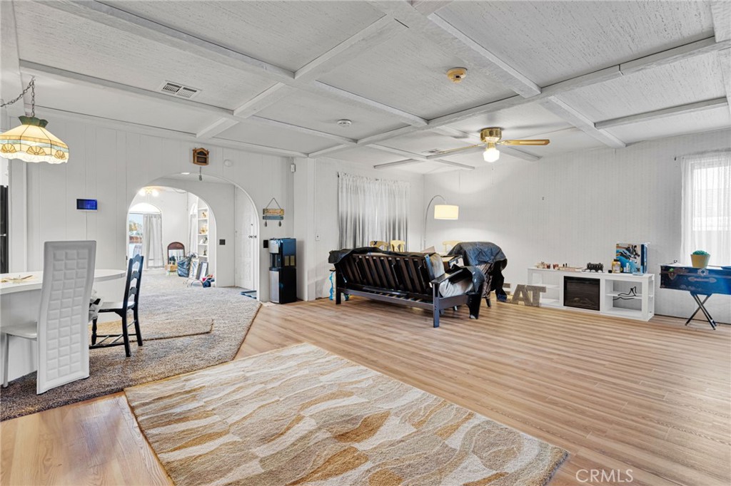 2494 Main Street Barstow, CA 92311 - Photo 4 of 36 a large room with lots of furniture and a chandelier