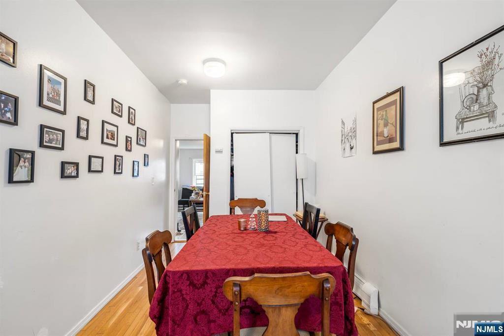 413 Adams Street Hoboken, NJ 07030 - Photo 11 of 40 a dining room with furniture and window