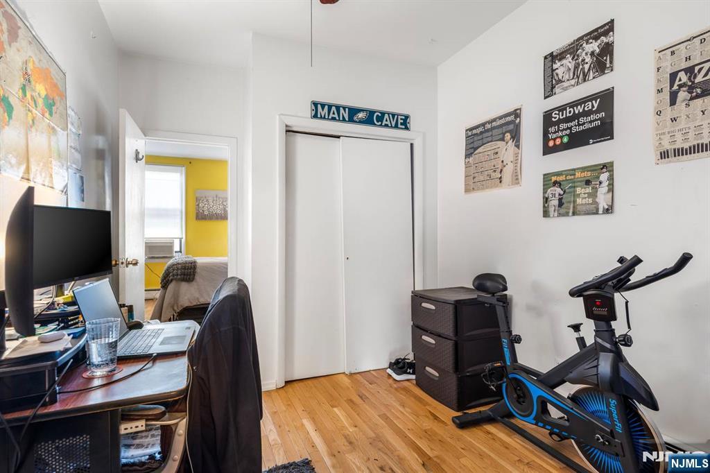 413 Adams Street Hoboken, NJ 07030 - Photo 12 of 40 a view of a workspace with furniture and a window