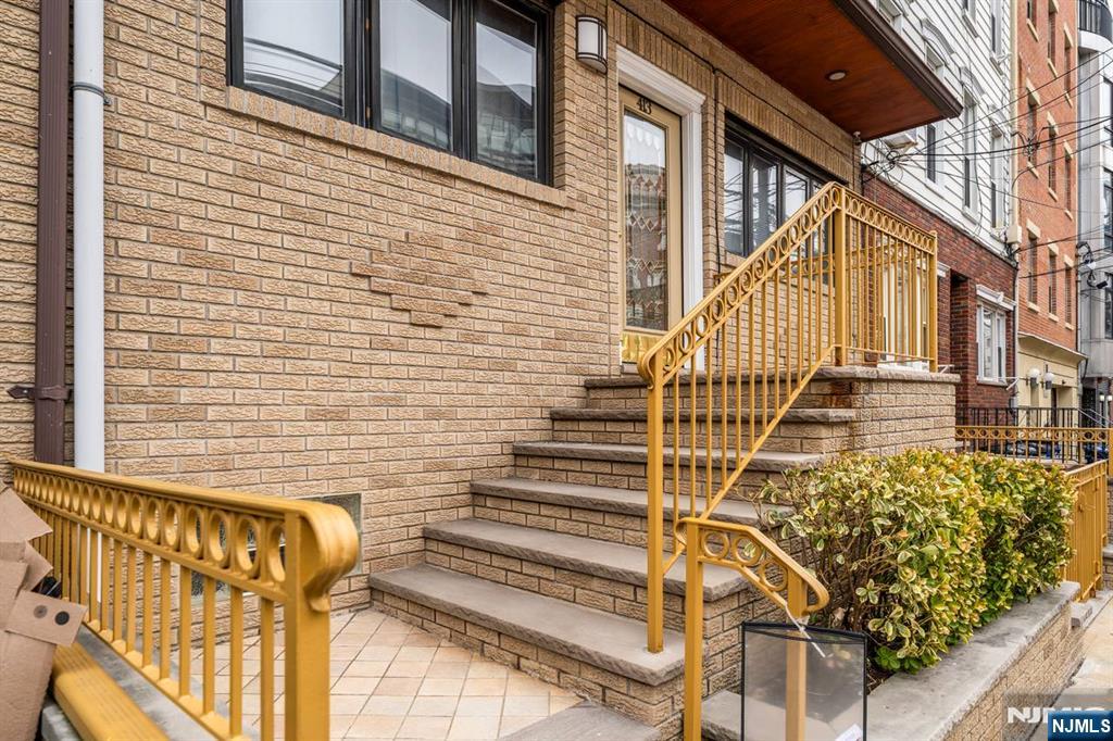 413 Adams Street Hoboken, NJ 07030 - Photo 2 of 40 a view of a brick building with many windows