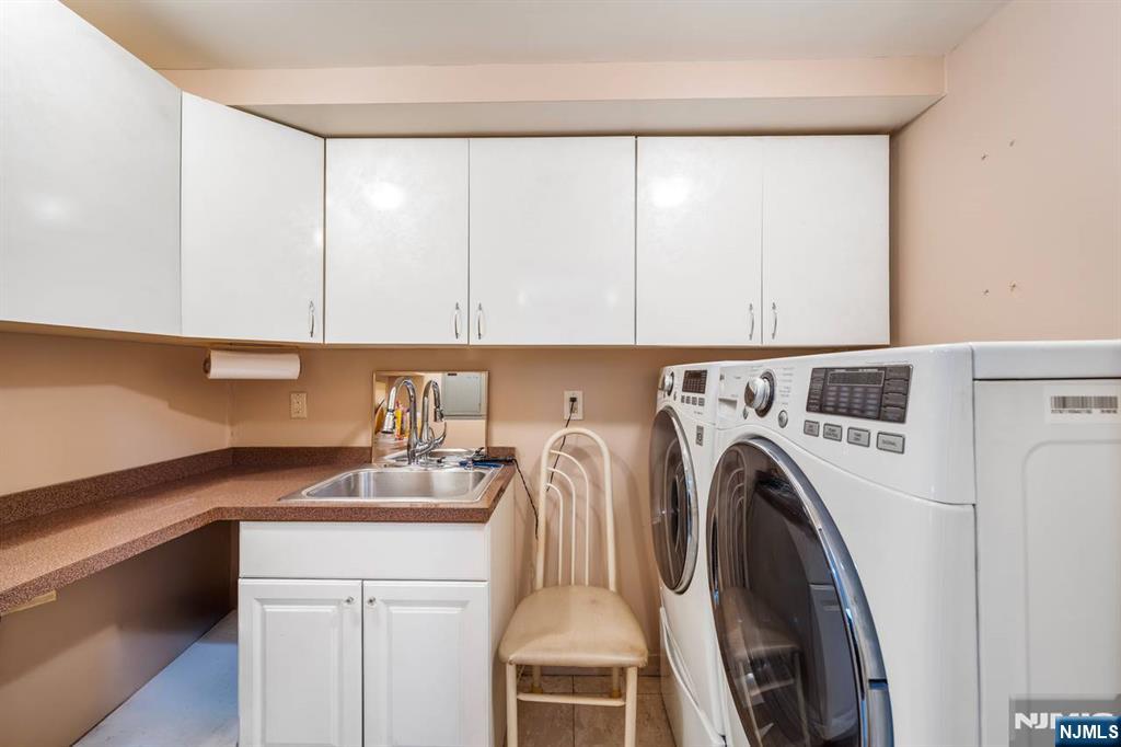 413 Adams Street Hoboken, NJ 07030 - Photo 34 of 40 a utility room with dryer and washer