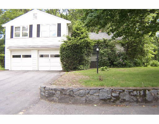 40 Deerfield Road Needham, MA 02492 - Photo 1 of 1 a white house that has a tree in front of it