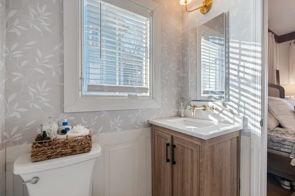 a bathroom with a sink and a window