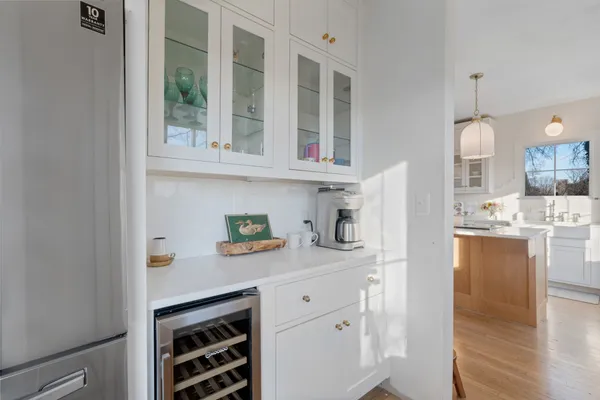 a kitchen with stainless steel appliances a sink stove and cabinets