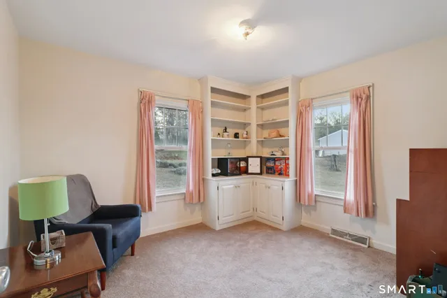 a view of workspace with furniture and windows