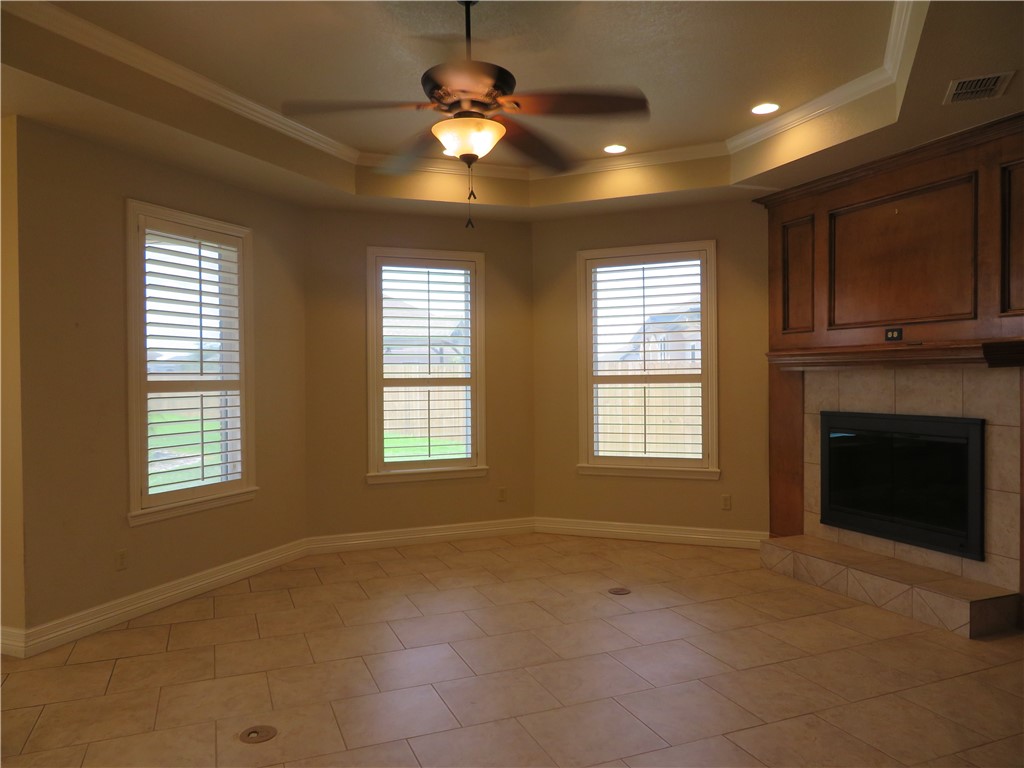 5803 South Oso Parkway Corpus Christi, TX 78414 - Photo 7 of 39 a view of an empty room with a fireplace and a window