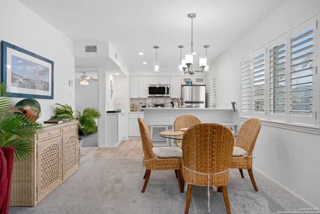 a dining room with furniture and window