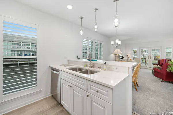 a kitchen with a sink and a window