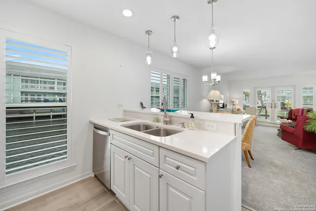 a kitchen with a sink and a window