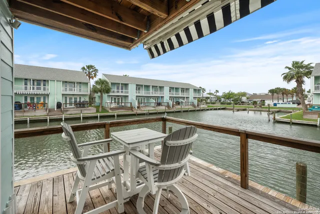 a view of a swimming pool with outdoor seating
