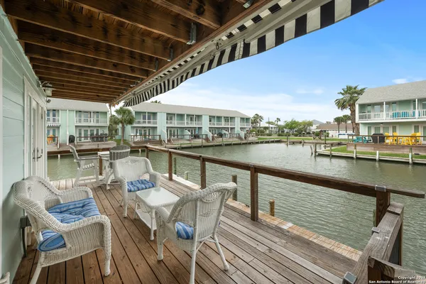 a view of a chairs and table on the deck