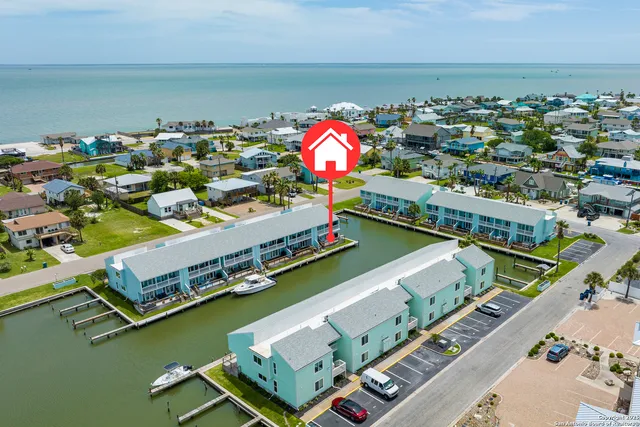 a bathroom with a granite countertop sink a toilet a mirror and shower
