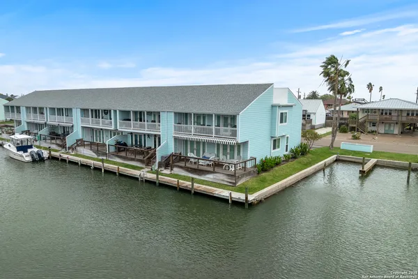 a view of a swimming pool with lounge chair