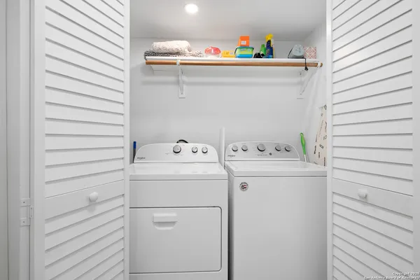a utility room with dryer and washer