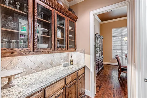 a kitchen with stainless steel appliances granite countertop a sink and a refrigerator