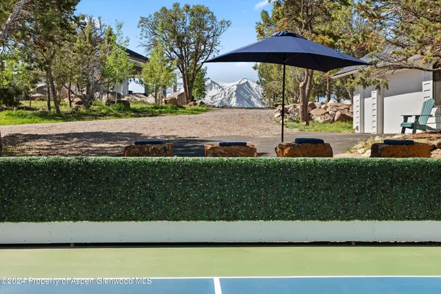 a patio with table and chairs