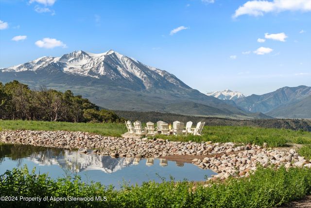 a view of a lake with a mountain in the background