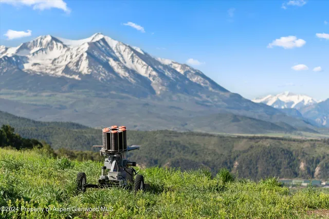 a living room with furniture fireplace and flat screen tv