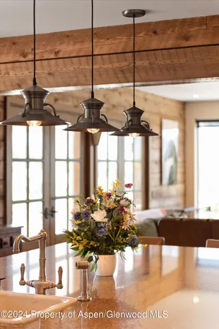 a bathroom with a granite countertop sink mirror vanity and toilet