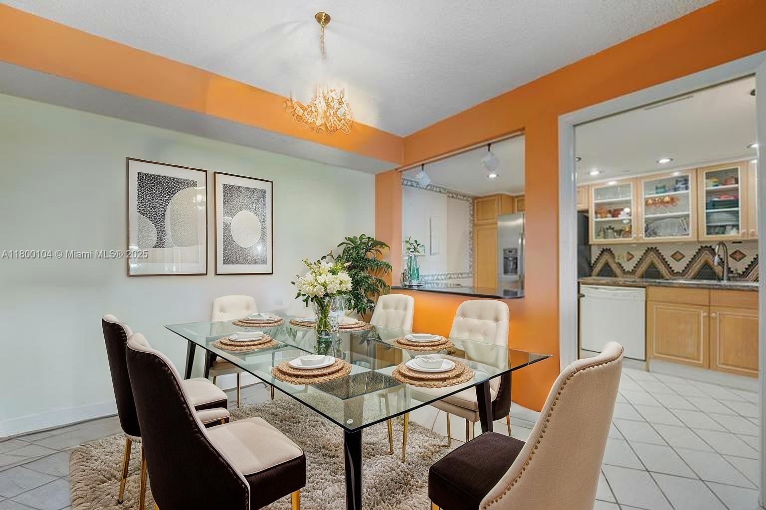 4000 Towerside Terrace, Unit 1403 Miami, FL 33138 - Photo 11 of 59 a dining room with furniture and window