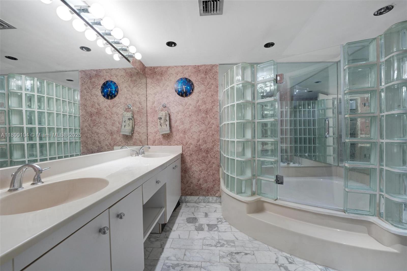 4000 Towerside Terrace, Unit 1403 Miami, FL 33138 - Photo 16 of 59 a bathroom with a double vanity sink mirror and shower