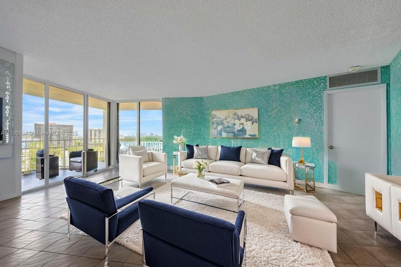 4000 Towerside Terrace, Unit 1403 Miami, FL 33138 - Photo 21 of 59 a living room with furniture and a large window