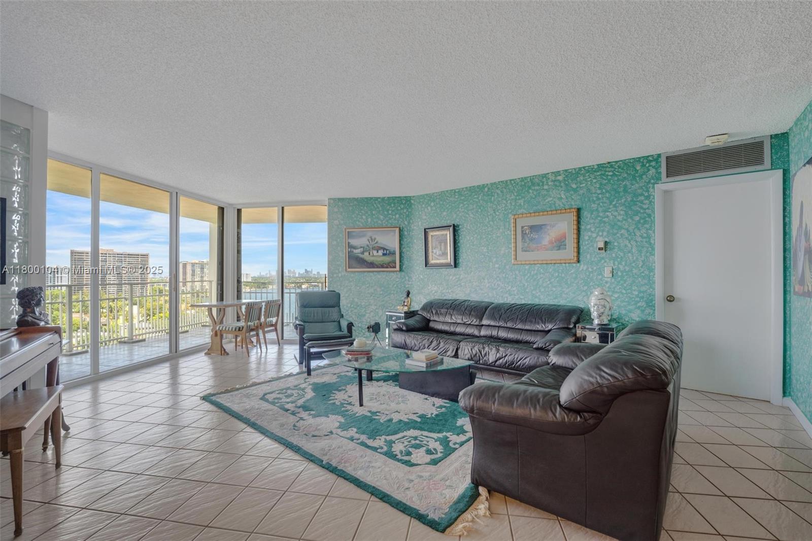 4000 Towerside Terrace, Unit 1403 Miami, FL 33138 - Photo 22 of 59 a living room with furniture and a large window