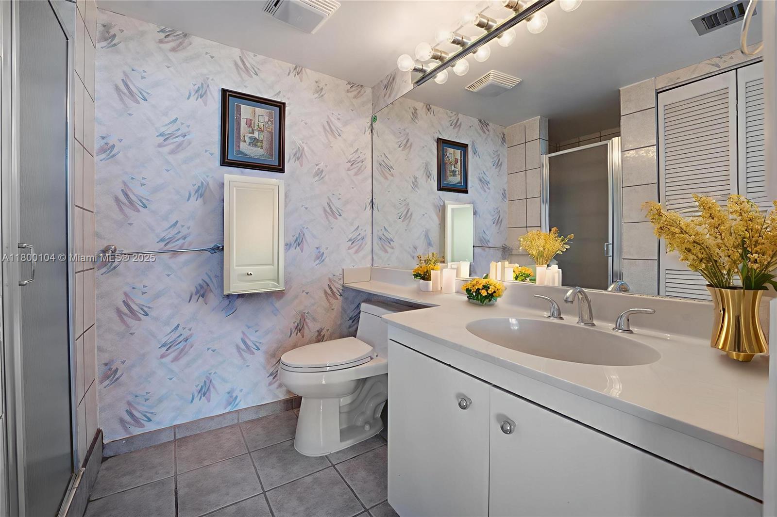 4000 Towerside Terrace, Unit 1403 Miami, FL 33138 - Photo 23 of 59 a bathroom with a sink toilet and shower