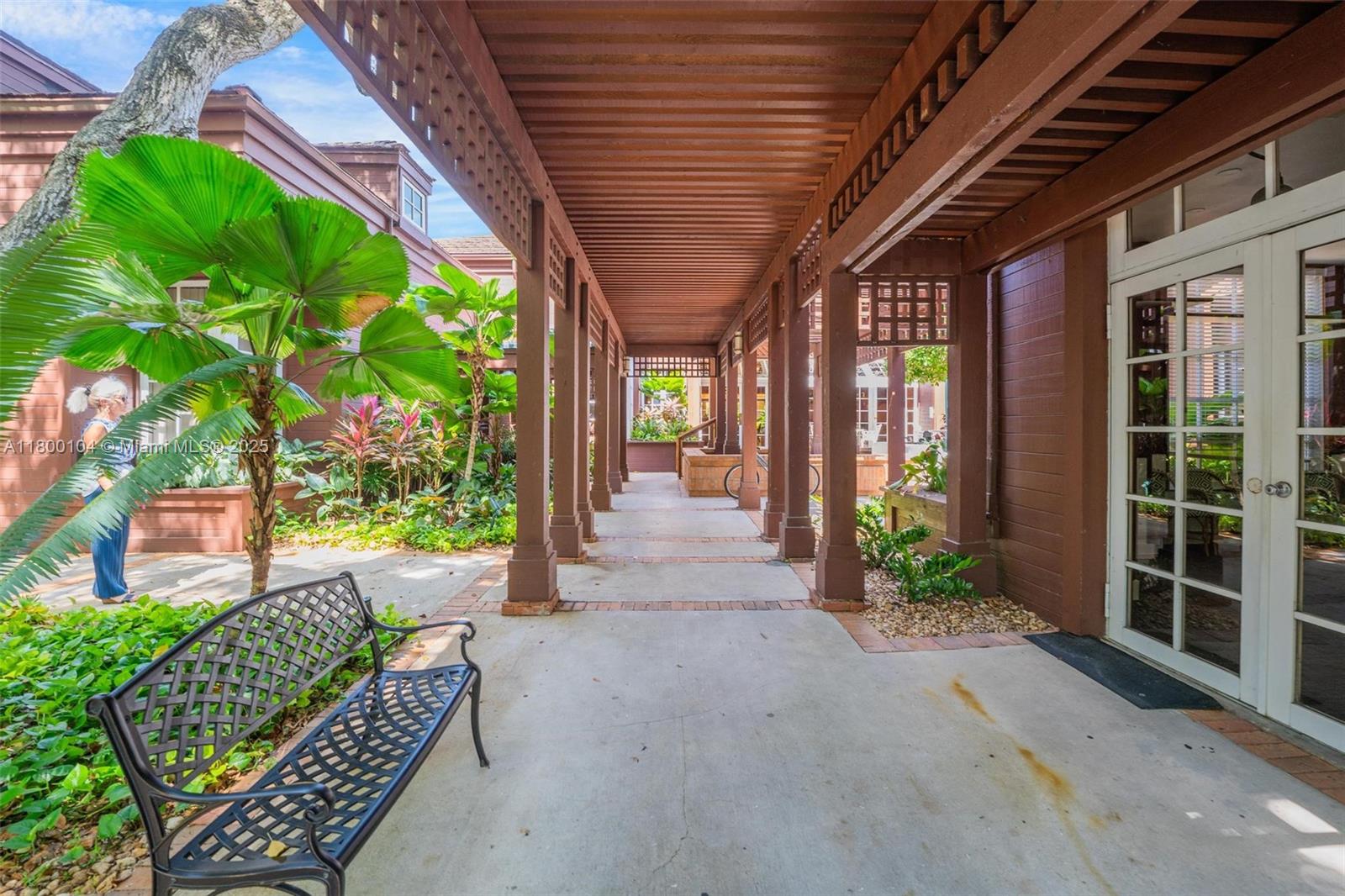 4000 Towerside Terrace, Unit 1403 Miami, FL 33138 - Photo 32 of 59 a view of a porch with furniture and garden