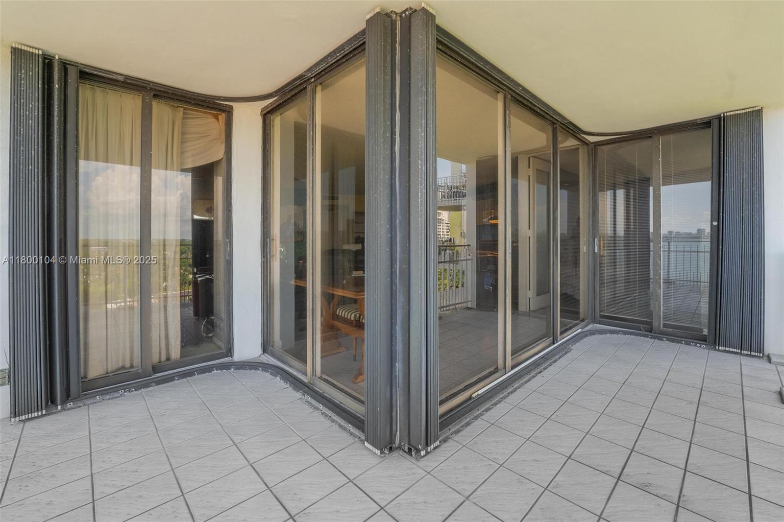 4000 Towerside Terrace, Unit 1403 Miami, FL 33138 - Photo 57 of 59 a view of a bathroom with a glass door