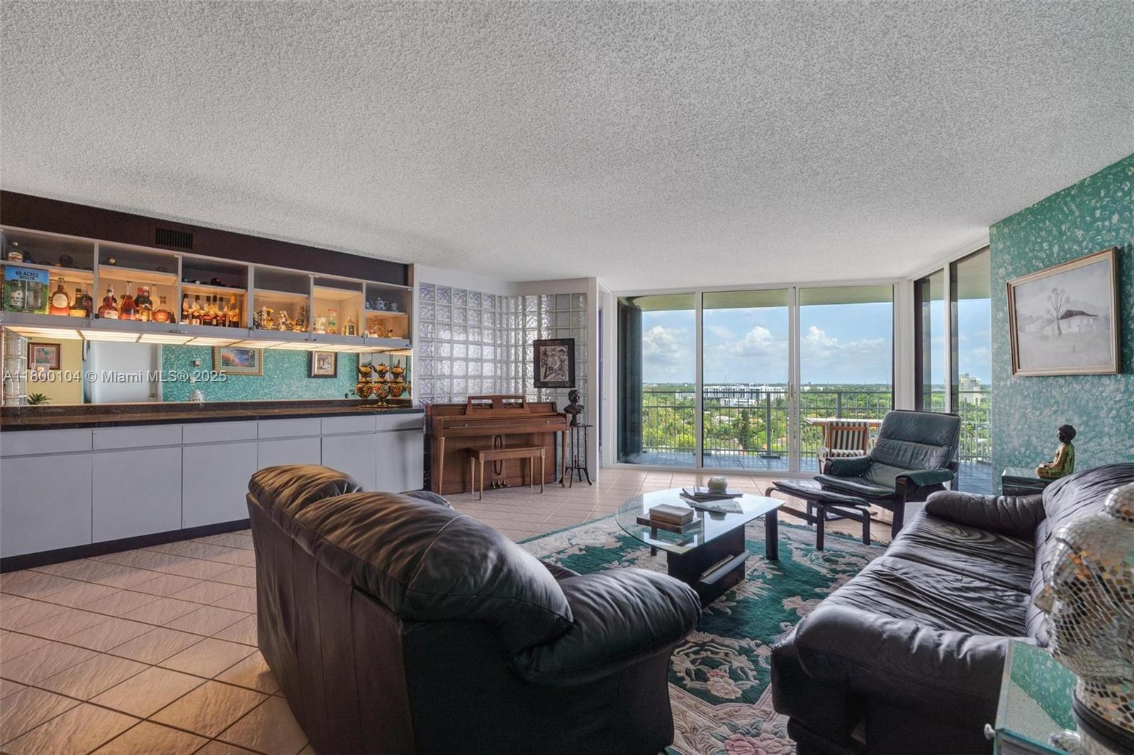 4000 Towerside Terrace, Unit 1403 Miami, FL 33138 - Photo 8 of 59 a living room with furniture and large windows