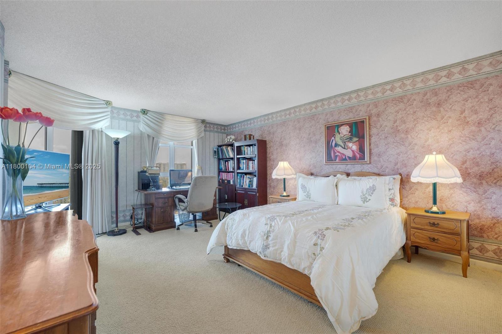 4000 Towerside Terrace, Unit 1403 Miami, FL 33138 - Photo 10 of 59 a bedroom with a large bed couch and a window