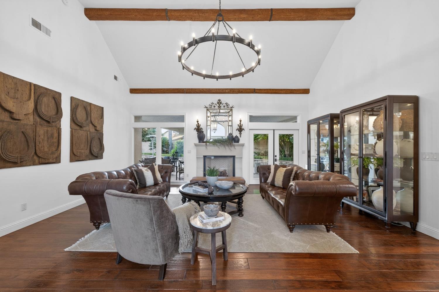 601 Decatur Avenue Clovis, CA 93611 - Photo 11 of 62 a living room with furniture chandelier and a large window
