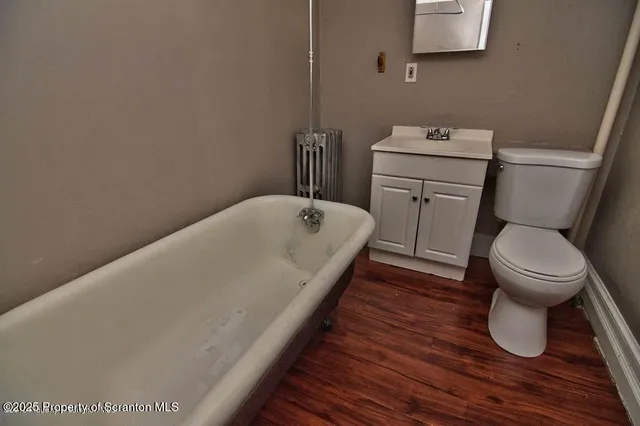 a bathroom with a sink and toilet
