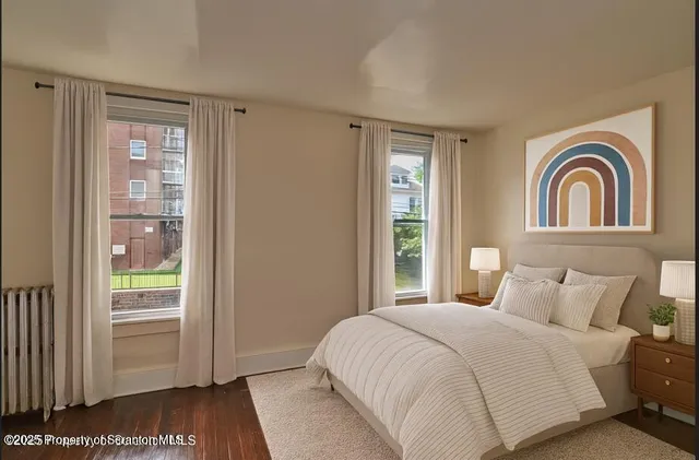 a view of hallway with wooden floor