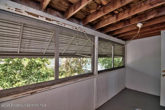 a view of a room with a large window