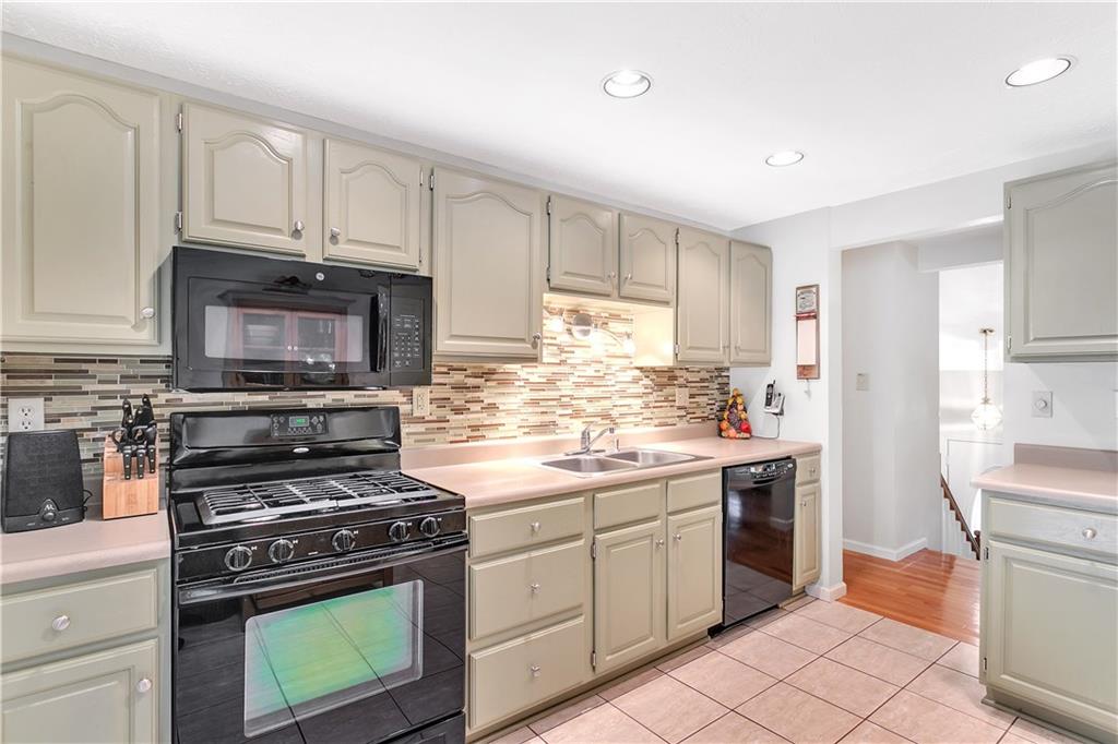 5896 Claridge Export Road Export, PA 15632 - Photo 11 of 25 Refreshed kitchen with solid surface counters, recessed lighting and light ceramic flooring