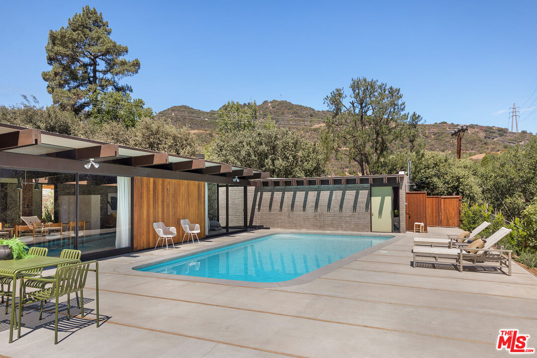 272 Mesa Lila Road Glendale, CA 91208 - Photo 17 of 46 a view of a chairs and tables in the patio