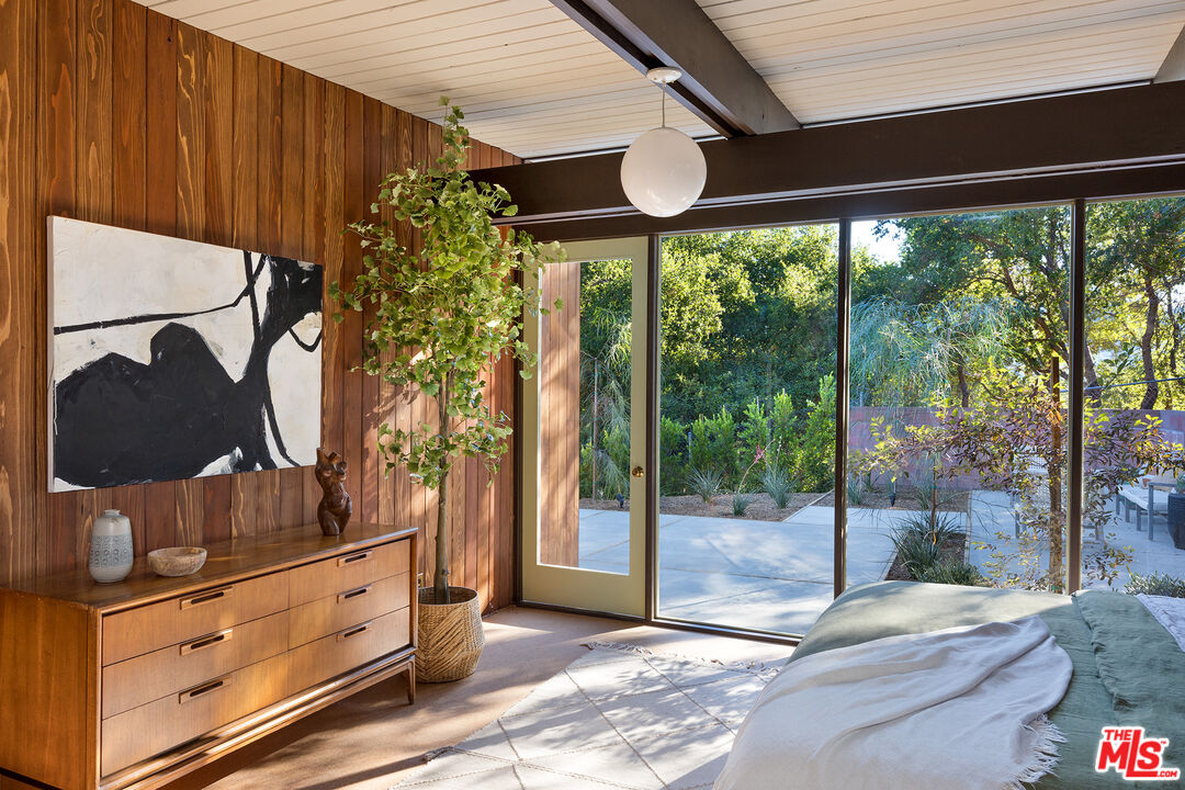 272 Mesa Lila Road Glendale, CA 91208 - Photo 22 of 46 a bedroom with furniture and large windows