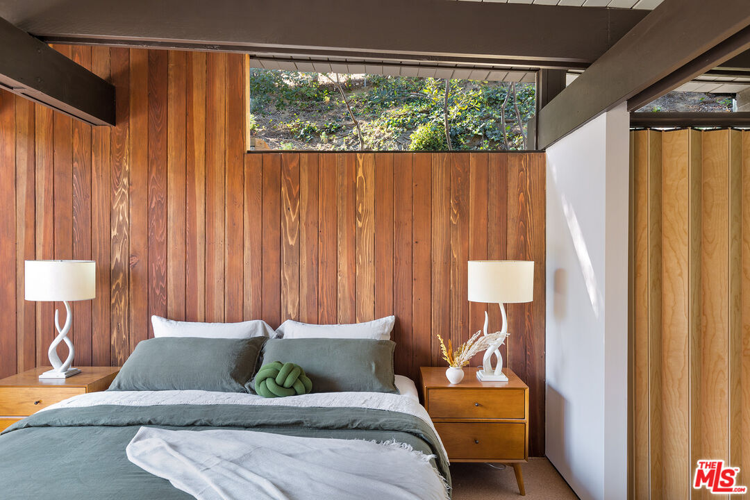 272 Mesa Lila Road Glendale, CA 91208 - Photo 23 of 46 a bedroom with a bed and wooden floor