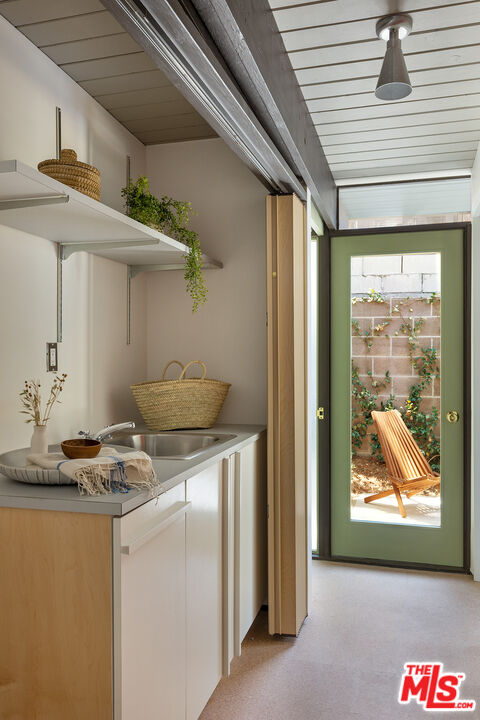 272 Mesa Lila Road Glendale, CA 91208 - Photo 34 of 46 a kitchen with stainless steel appliances granite countertop a stove and a refrigerator