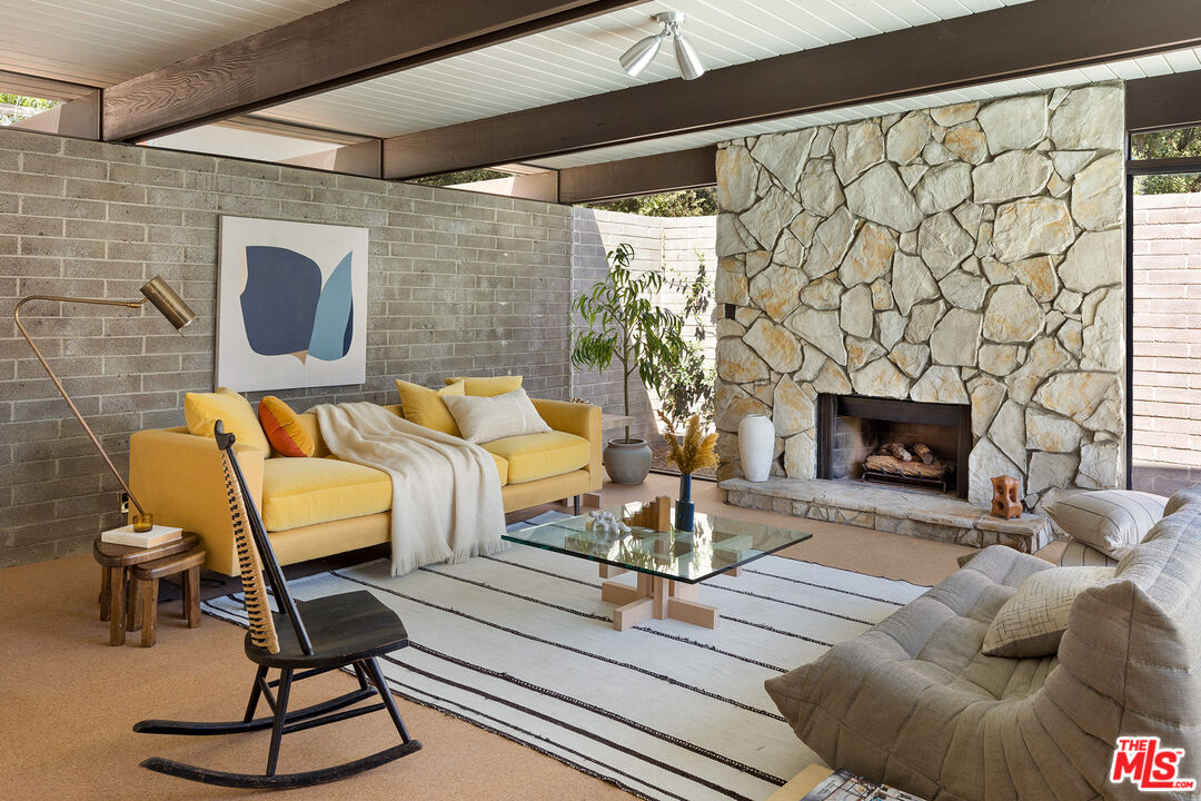 272 Mesa Lila Road Glendale, CA 91208 - Photo 6 of 46 a living room with furniture and a fireplace