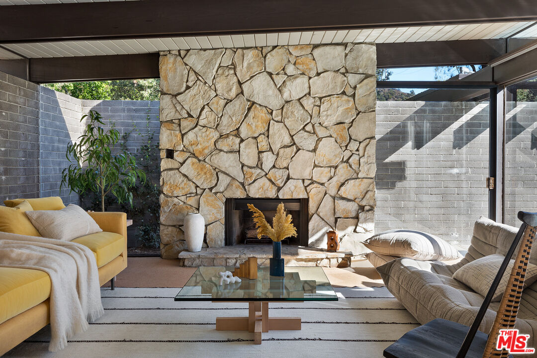 272 Mesa Lila Road Glendale, CA 91208 - Photo 7 of 46 a living room with furniture and a fireplace